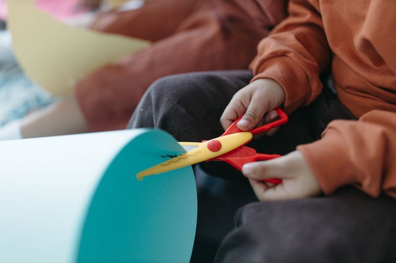 Child sitting with a colorful, child-friendly lunch at daycare