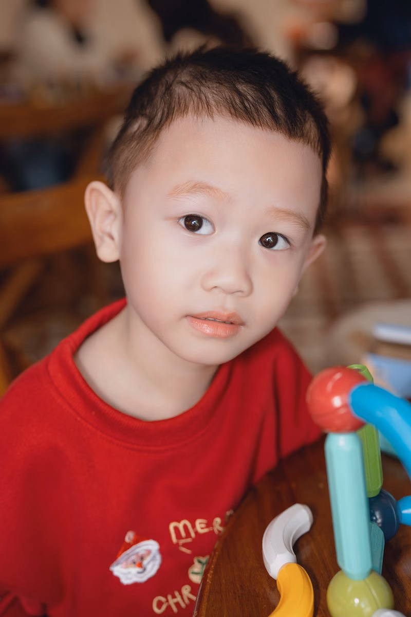 Preschool child matching picture cards during a focused daycare activity